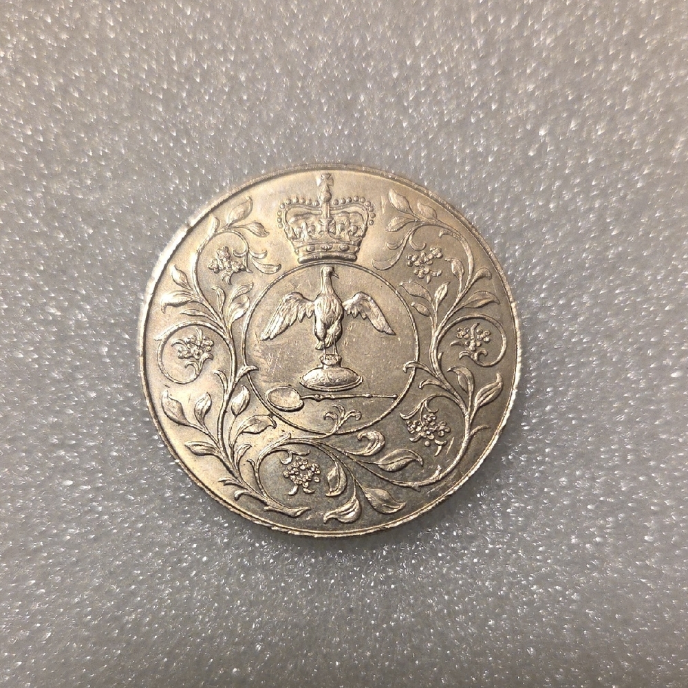 Vintage Coin with Crown and Bird Design